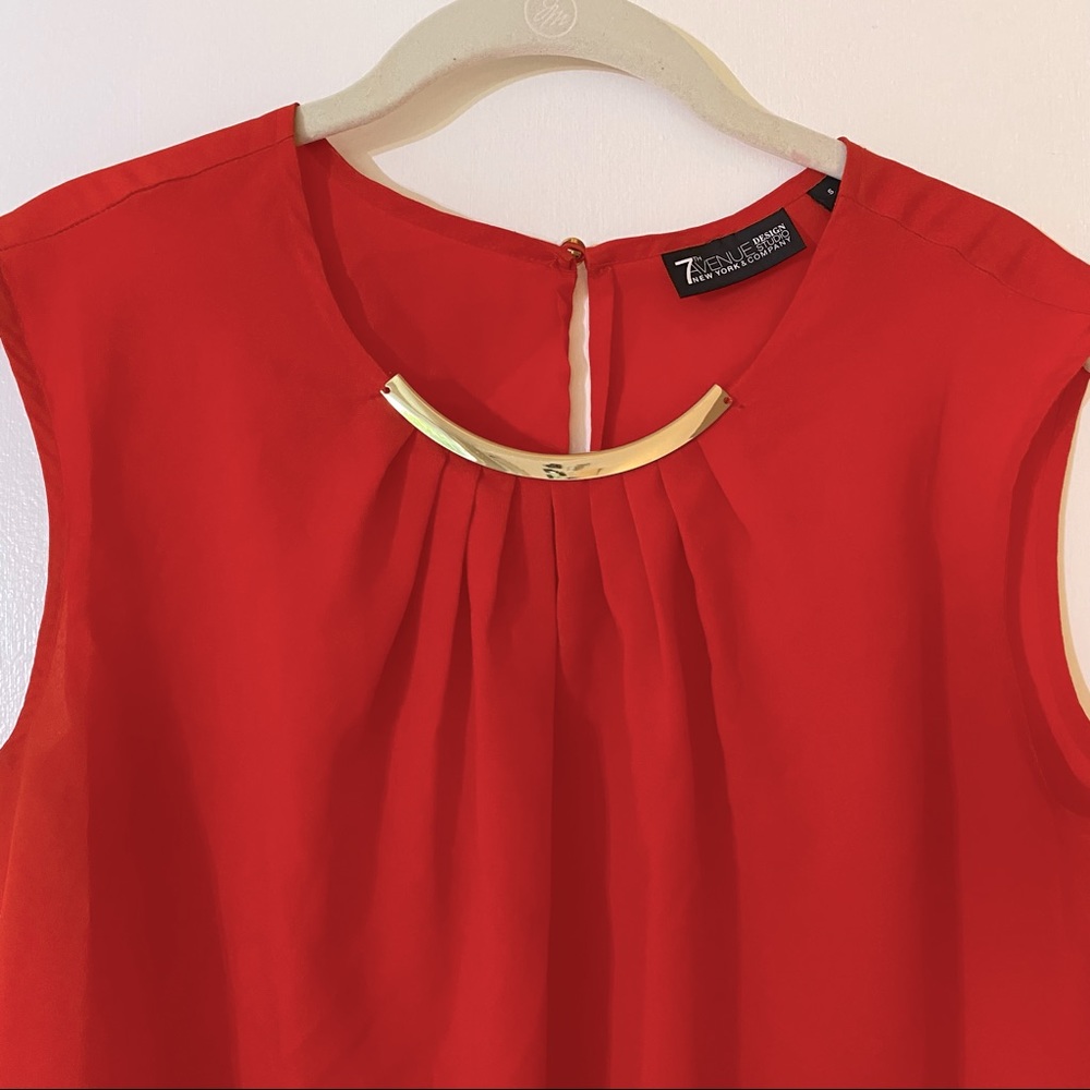 Sleeveless top with gold neckline